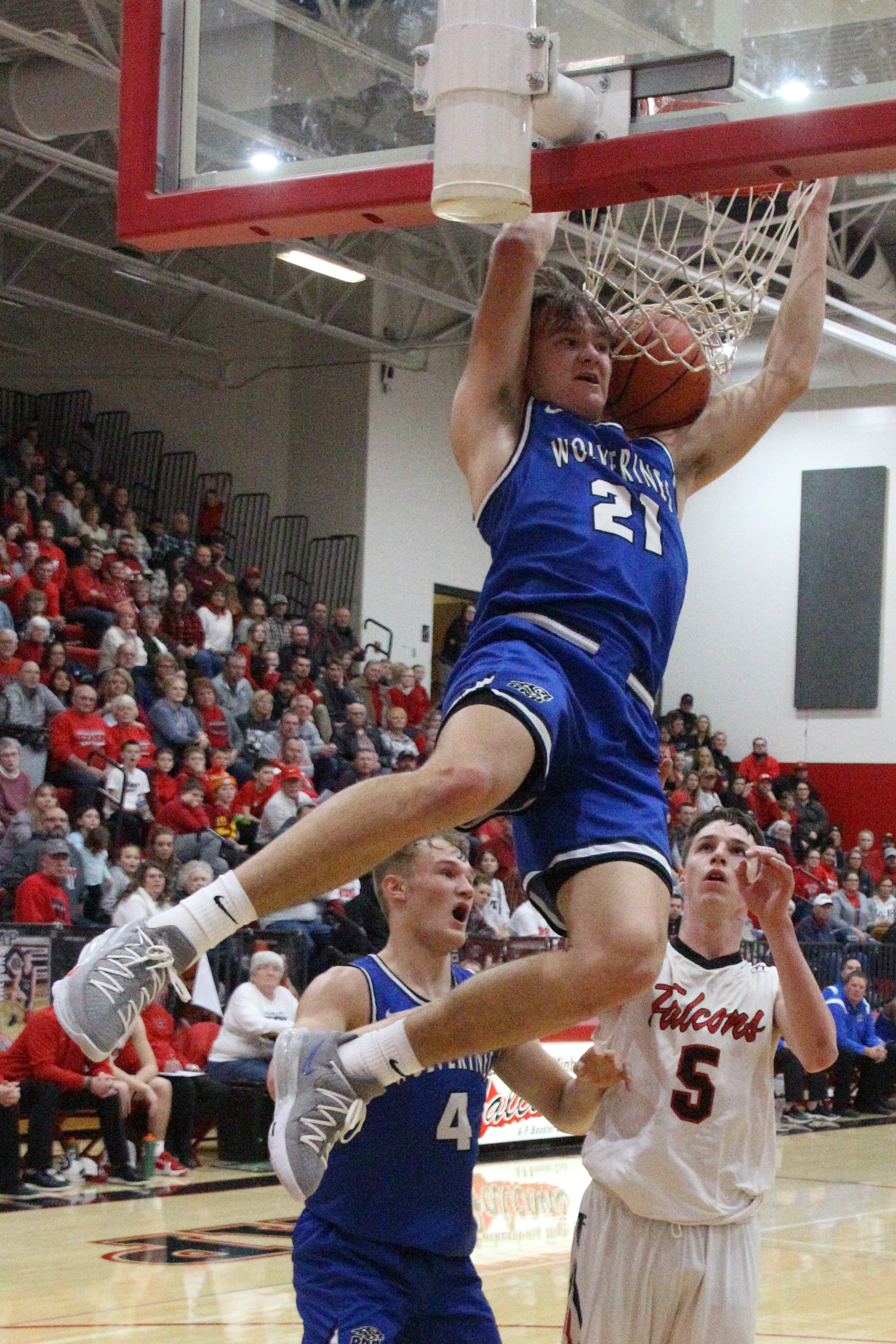 Image Description: D-NH&#039;s Brewer Eiklenborg (21) throws down the two-handed jam. (Jake Ryder photo)